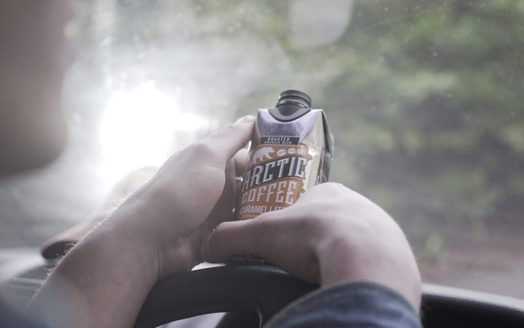 Man in van with Arctic Coffee
