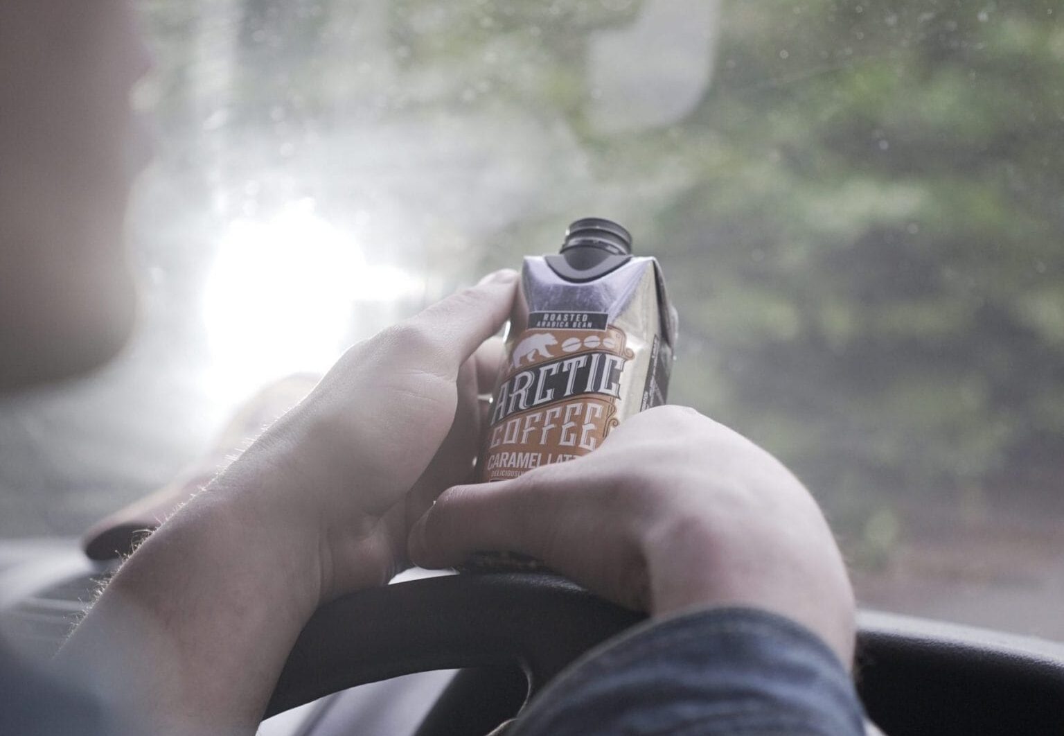 Man in van with Arctic Coffee