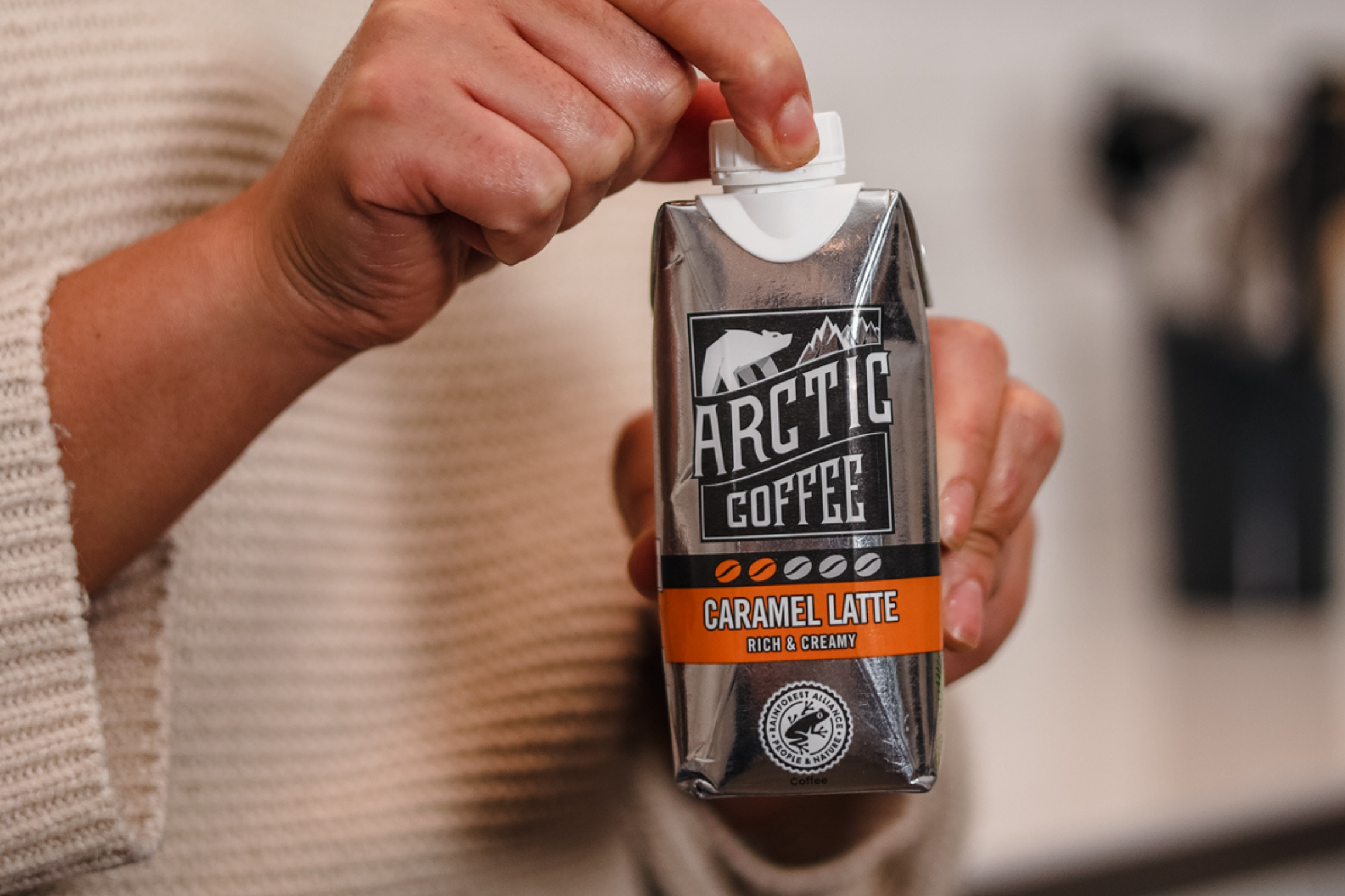 Person holding Arctic Caramel Latte Person holding Arctic Caramel Latte